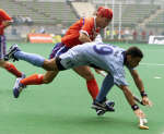 Deepak Thakur tumbles while racing for the ball with South Korea's Kim Jung-Chul - Reuters