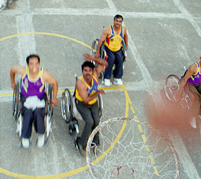 The inmates in action on the basketball courts
